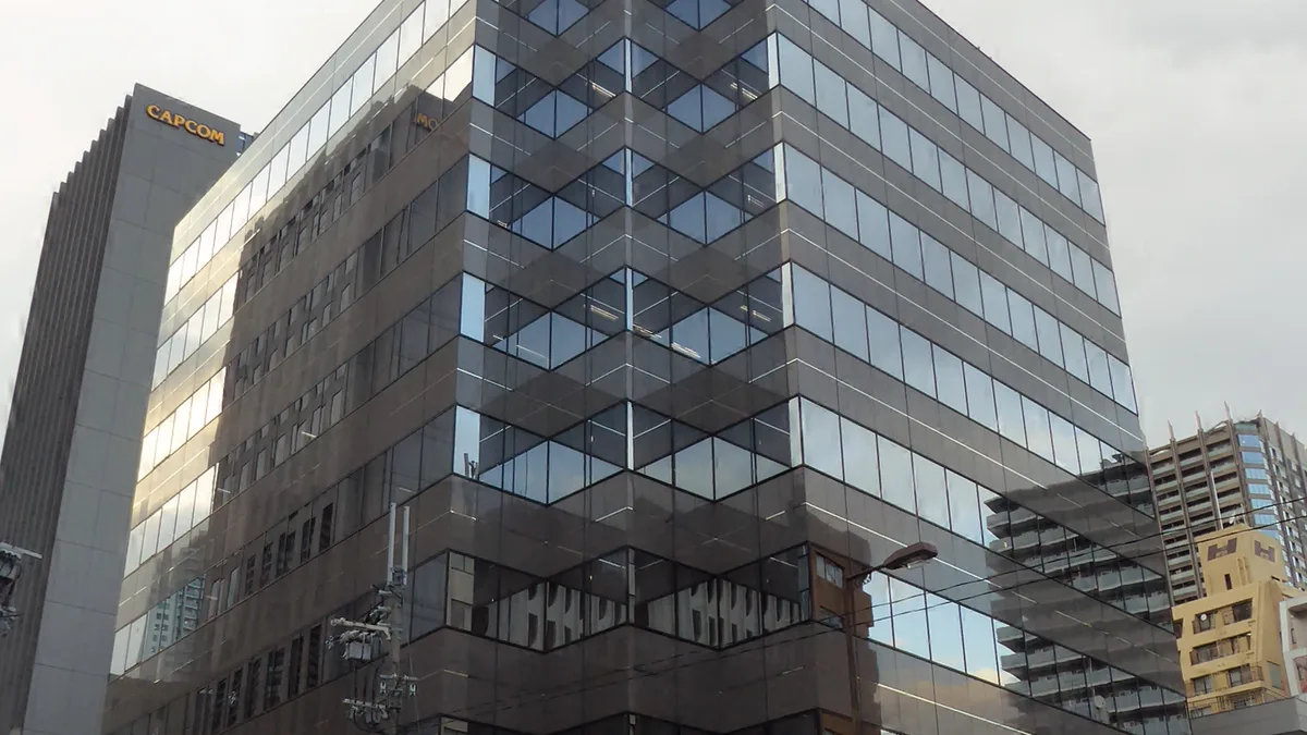 Capcom headquarters in Osaka, with the CAPCOM sign on the building behind it