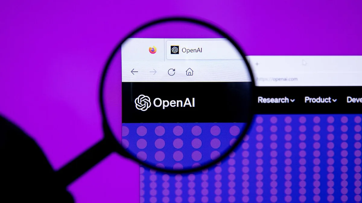 The OpenAI logo on a browser tab and website, seen through a magnifying glass