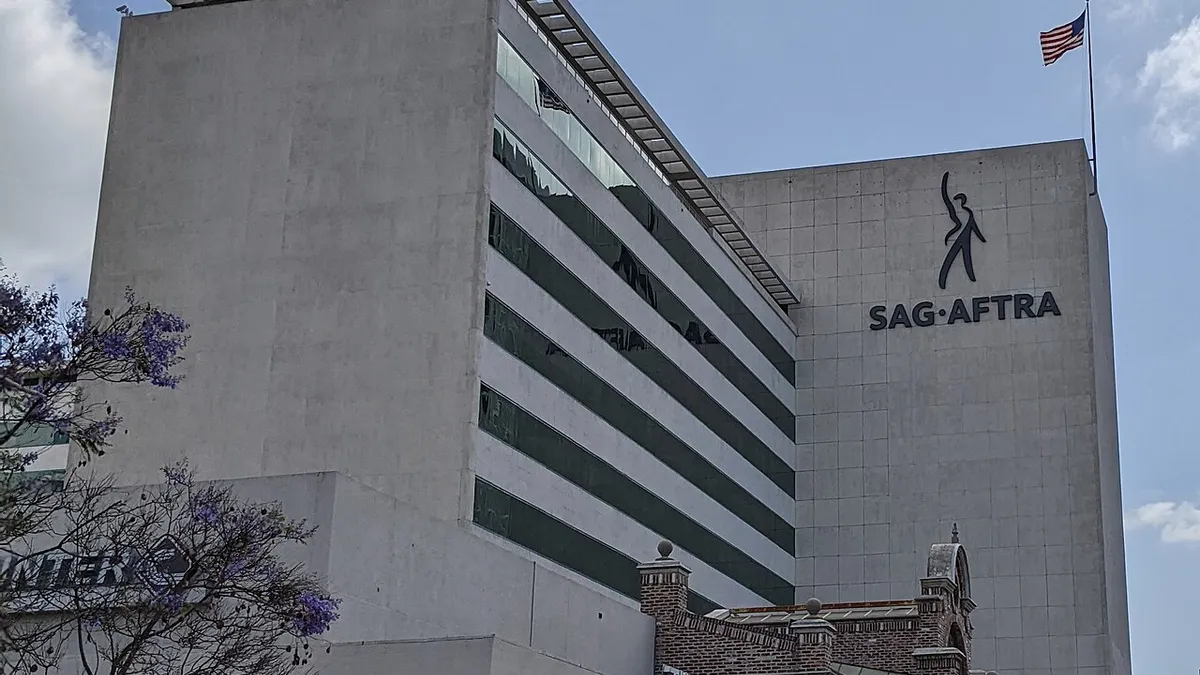 The SAG-AFTRA headquarters building in Los Angeles with the union logo on its wall